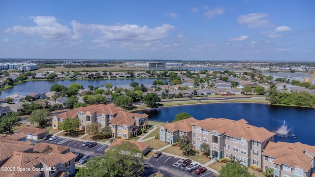 aerial view with a water view and a residential view