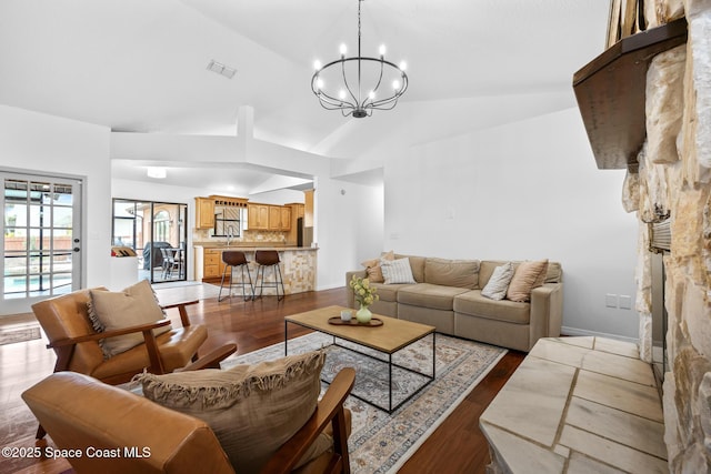 4730 Seminole Trl, Merritt Island, FL 32953 - living area with high vaulted ceiling, a chandelier, dark wood-style floors, and visible vents