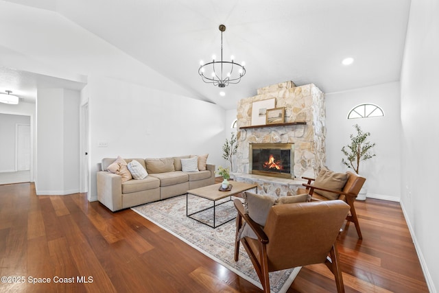 4730 Seminole Trl, Merritt Island, FL 32953 - living room featuring wood finished floors, lofted ceiling, a fireplace, and an inviting chandelier
