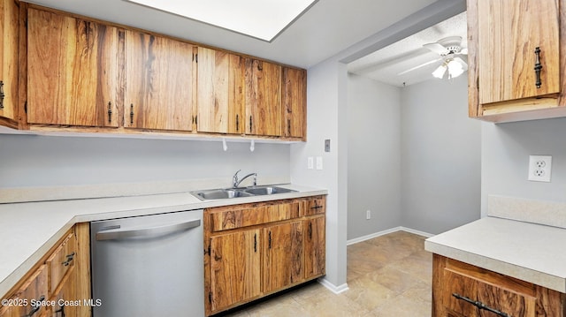 kitchen featuring a sink, light countertops, brown cabinetry, and dishwasher