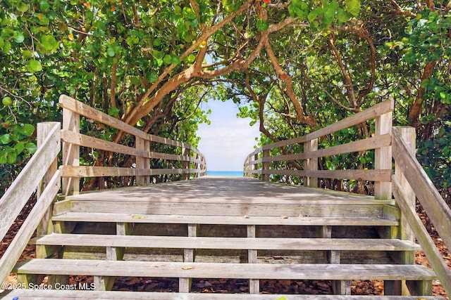 wooden deck featuring a water view