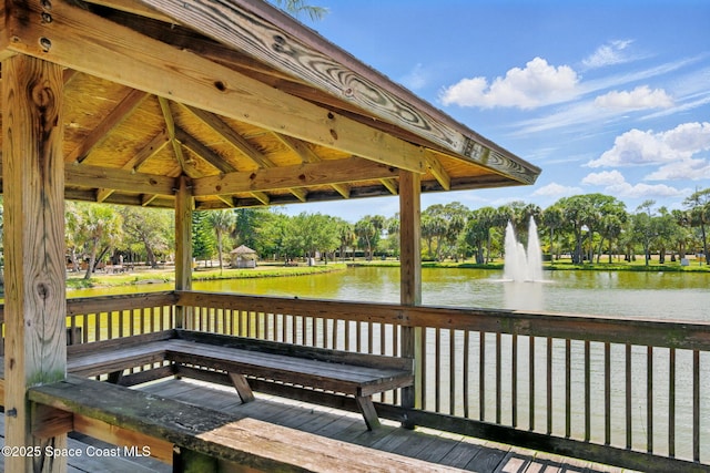 view of dock with a water view and a gazebo