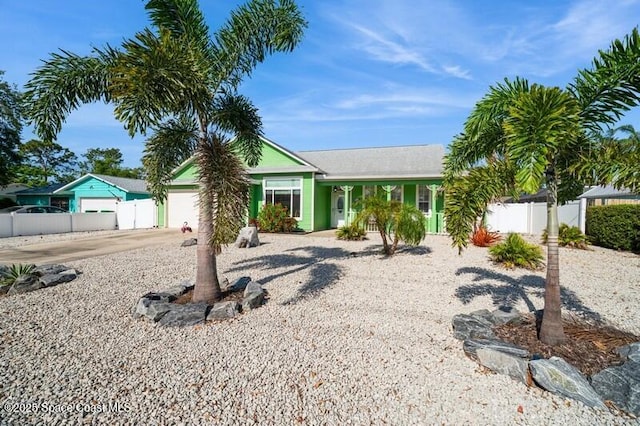 6190 Alderwood Ave, Cocoa, FL 32927 - ranch-style home featuring fence, driveway, and a garage