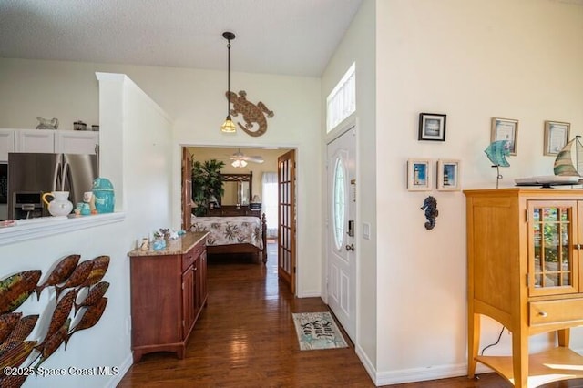 6190 Alderwood Ave, Cocoa, FL 32927 - entrance foyer with baseboards, dark wood finished floors, and ceiling fan