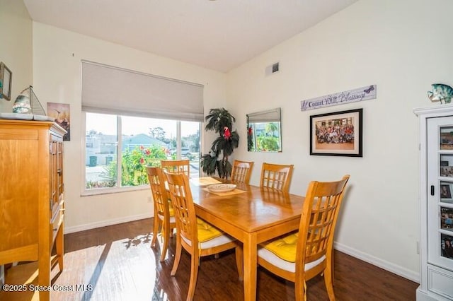 6190 Alderwood Ave, Cocoa, FL 32927 - dining space with baseboards, wood finished floors, and visible vents