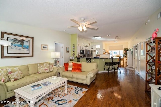 6190 Alderwood Ave, Cocoa, FL 32927 - living area with dark wood-type flooring and ceiling fan