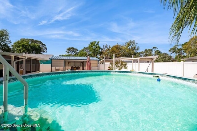 6190 Alderwood Ave, Cocoa, FL 32927 - view of swimming pool with fence, a sunroom, and a fenced in pool