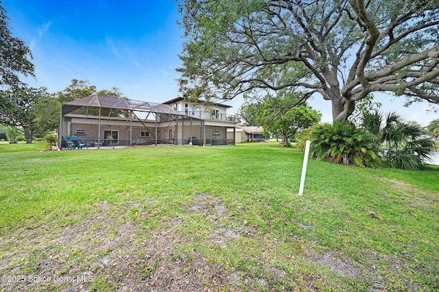 1428 Gleneagles Way, Rockledge, FL 32955 - view of yard featuring a lanai