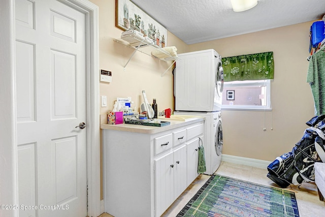 1428 Gleneagles Way, Rockledge, FL 32955 - laundry area featuring baseboards, light tile patterned flooring, stacked washer / drying machine, and cabinet space