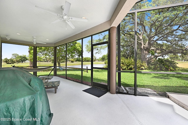 1428 Gleneagles Way, Rockledge, FL 32955 - sunroom / solarium featuring a water view, a ceiling fan, and plenty of natural light