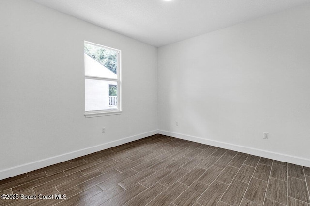 8050 96th Ave, Vero Beach, FL 32967 - unfurnished room featuring baseboards and dark wood finished floors