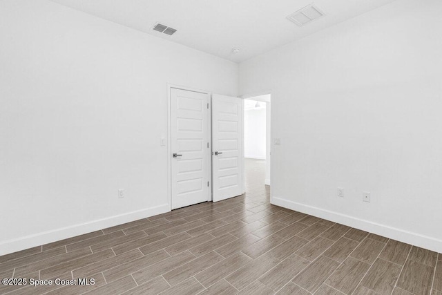 8050 96th Ave, Vero Beach, FL 32967 - spare room featuring wood finished floors and baseboards