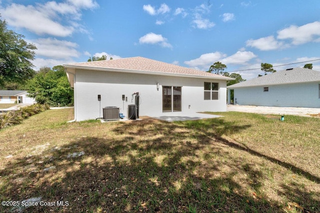 8050 96th Ave, Vero Beach, FL 32967 - back of house with a yard, a patio, and stucco siding
