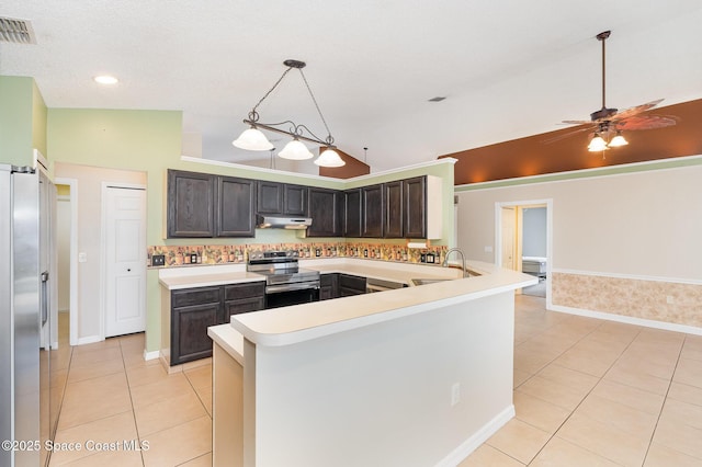 kitchen featuring light countertops, stainless steel appliances, a peninsula, light tile patterned floors, and visible vents
