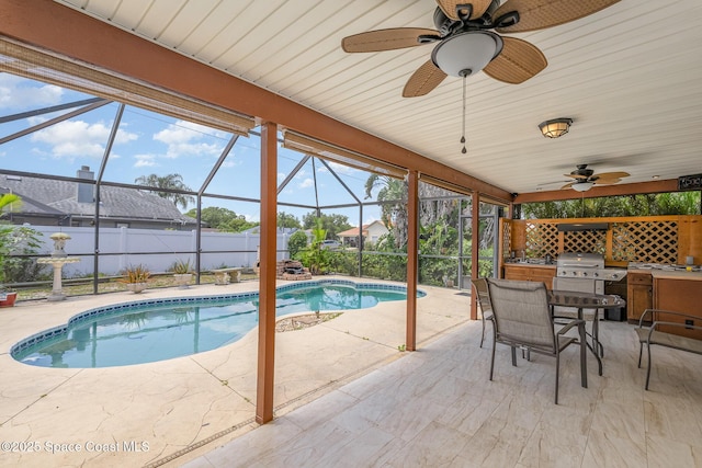 view of swimming pool with fence, a patio, ceiling fan, and glass enclosure