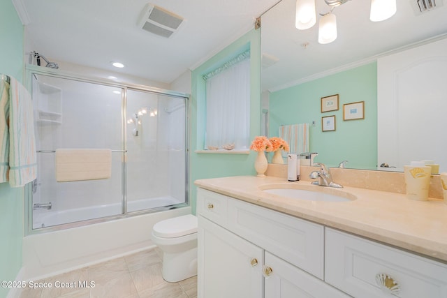 bathroom with vanity, enclosed tub / shower combo, toilet, and visible vents