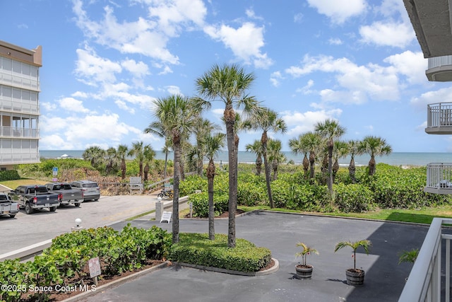 view of parking / parking lot featuring a water view