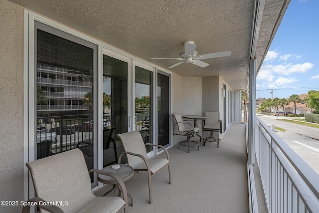 balcony featuring a ceiling fan