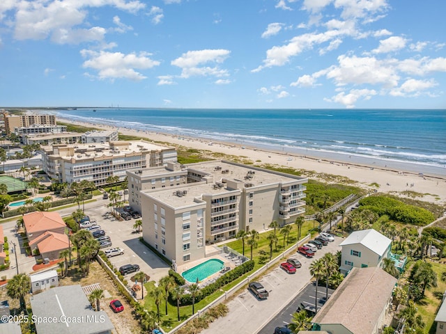 bird's eye view featuring a beach view and a water view