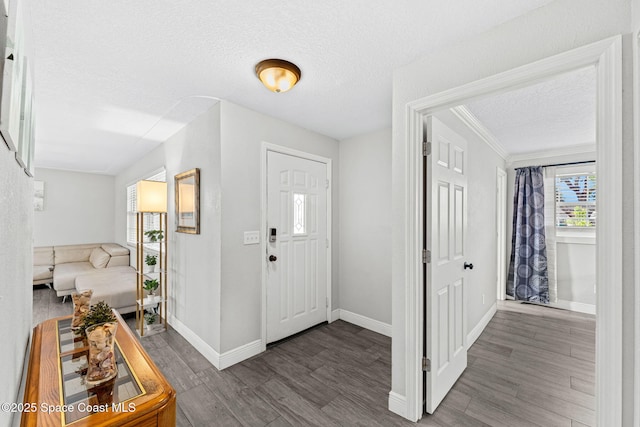 947 Bluewater Dr, Indian Harbour Beach, FL 32937 - entryway featuring a textured ceiling and wood finished floors
