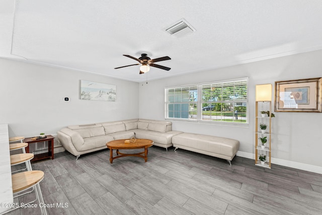 947 Bluewater Dr, Indian Harbour Beach, FL 32937 - living room with ceiling fan and wood finished floors