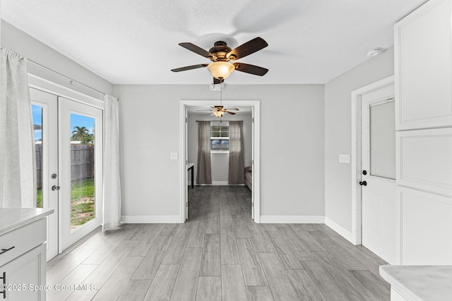 947 Bluewater Dr, Indian Harbour Beach, FL 32937 - foyer entrance featuring light wood-type flooring, ceiling fan, and french doors