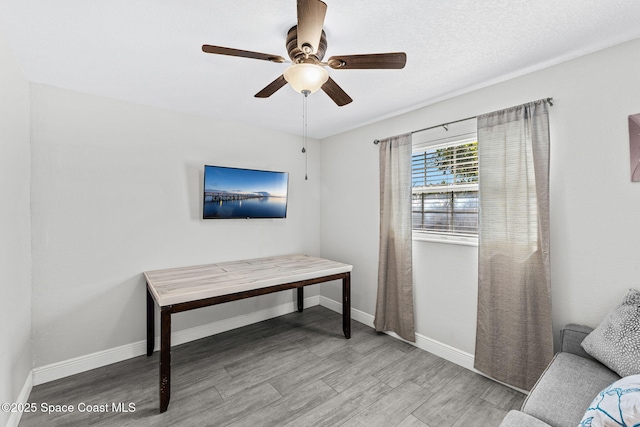 947 Bluewater Dr, Indian Harbour Beach, FL 32937 - living room with wood finished floors and ceiling fan
