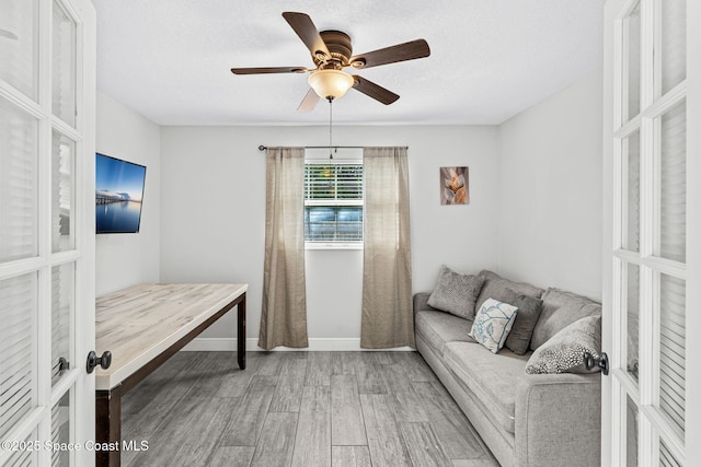 947 Bluewater Dr, Indian Harbour Beach, FL 32937 - living area featuring french doors, wood finished floors, a ceiling fan, and a textured ceiling