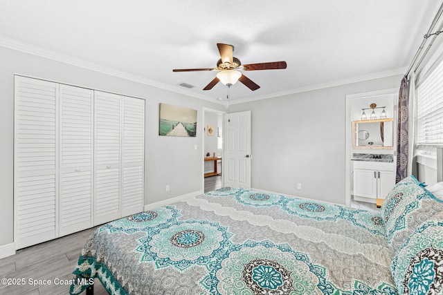 947 Bluewater Dr, Indian Harbour Beach, FL 32937 - bedroom featuring wood finished floors, ornamental molding, a closet, and ceiling fan