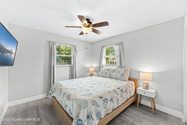 947 Bluewater Dr, Indian Harbour Beach, FL 32937 - bedroom with wood finished floors and a ceiling fan