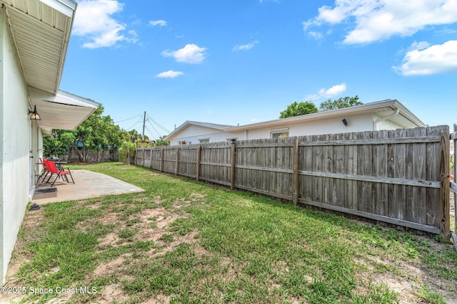 947 Bluewater Dr, Indian Harbour Beach, FL 32937 - fenced backyard featuring a patio area