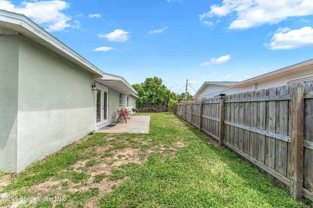 947 Bluewater Dr, Indian Harbour Beach, FL 32937 - fenced backyard with french doors and a patio