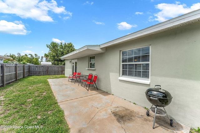 947 Bluewater Dr, Indian Harbour Beach, FL 32937 - fenced backyard with a patio area and a grill