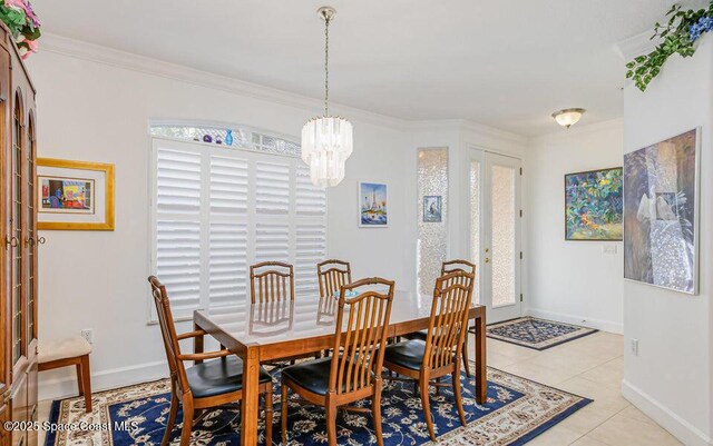 881 Glen Abbey Way, Melbourne, FL 32940 - dining room with baseboards, a notable chandelier, ornamental molding, and light tile patterned floors