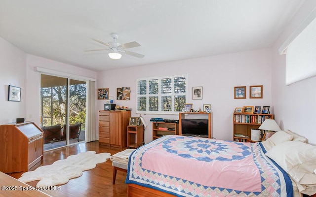 881 Glen Abbey Way, Melbourne, FL 32940 - bedroom with access to outside, a ceiling fan, and wood finished floors