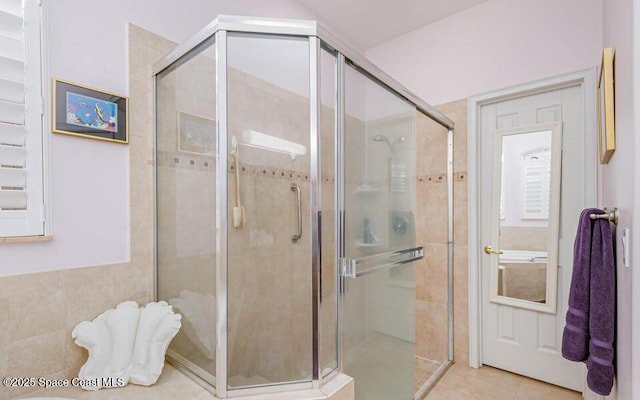 881 Glen Abbey Way, Melbourne, FL 32940 - bathroom featuring tile patterned floors and a shower stall