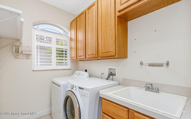 881 Glen Abbey Way, Melbourne, FL 32940 - laundry area featuring a sink, cabinet space, and washing machine and clothes dryer
