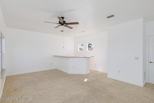 881 Glen Abbey Way, Melbourne, FL 32940 - unfurnished room with light colored carpet, ceiling fan, visible vents, and baseboards
