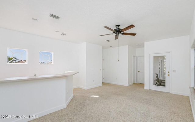 881 Glen Abbey Way, Melbourne, FL 32940 - spare room with a ceiling fan, baseboards, visible vents, and light carpet
