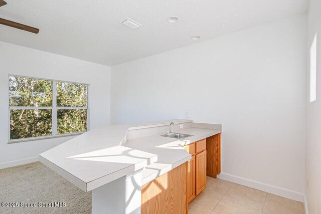 881 Glen Abbey Way, Melbourne, FL 32940 - bathroom featuring ceiling fan, visible vents, tile patterned flooring, a sink, and baseboards