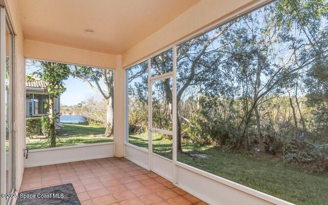 881 Glen Abbey Way, Melbourne, FL 32940 - unfurnished sunroom with a water view