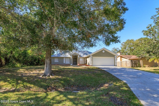 single story home featuring driveway, a garage, fence, a front lawn, and stucco siding