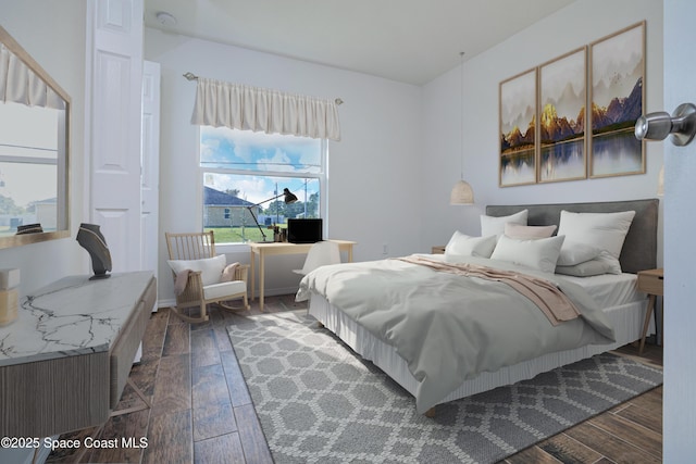 bedroom featuring dark wood finished floors
