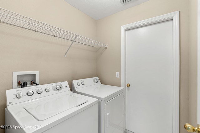 7416 Camio Ave, Cocoa, FL 32927 - laundry area with washing machine and clothes dryer