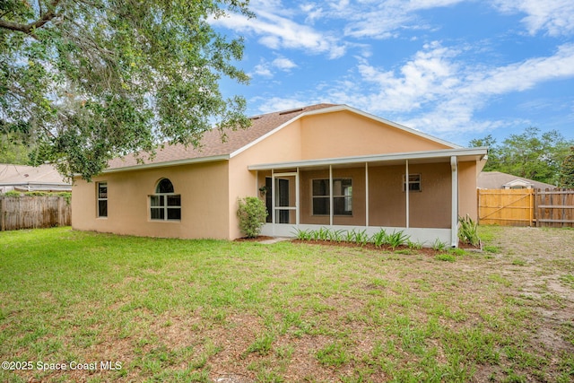 7416 Camio Ave, Cocoa, FL 32927 - rear view of property featuring a sunroom and stucco siding