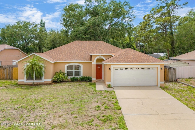 7416 Camio Ave, Cocoa, FL 32927 - ranch-style house with stucco siding, a shingled roof, a garage, and concrete driveway