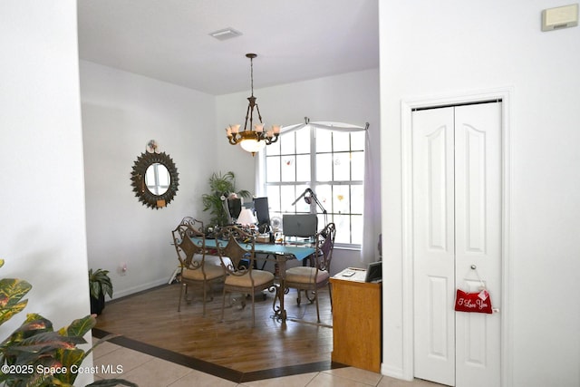 321 Brightwater Dr SE, Palm Bay, FL 32909 - tiled dining space with a chandelier and a desk