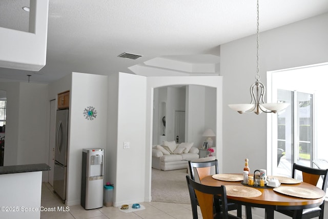 321 Brightwater Dr SE, Palm Bay, FL 32909 - dining space featuring light tile patterned floors and light colored carpet
