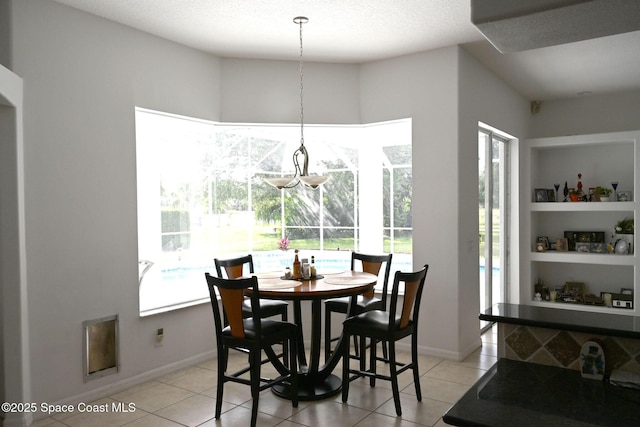 321 Brightwater Dr SE, Palm Bay, FL 32909 - dining space featuring light tile patterned floors and baseboards