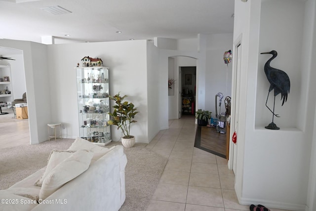 321 Brightwater Dr SE, Palm Bay, FL 32909 - corridor featuring arched walkways and light tile patterned floors